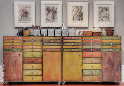 Colorful wooden drawers in cabinet