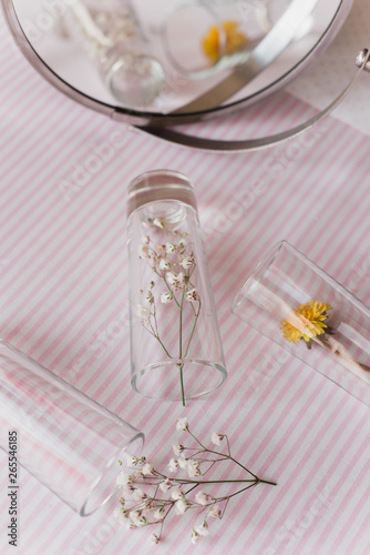 fragrance of flowers: gypsophila and dandelion flowers under glass shots