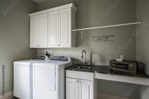 Washing machine, dryer and sink in laundry room