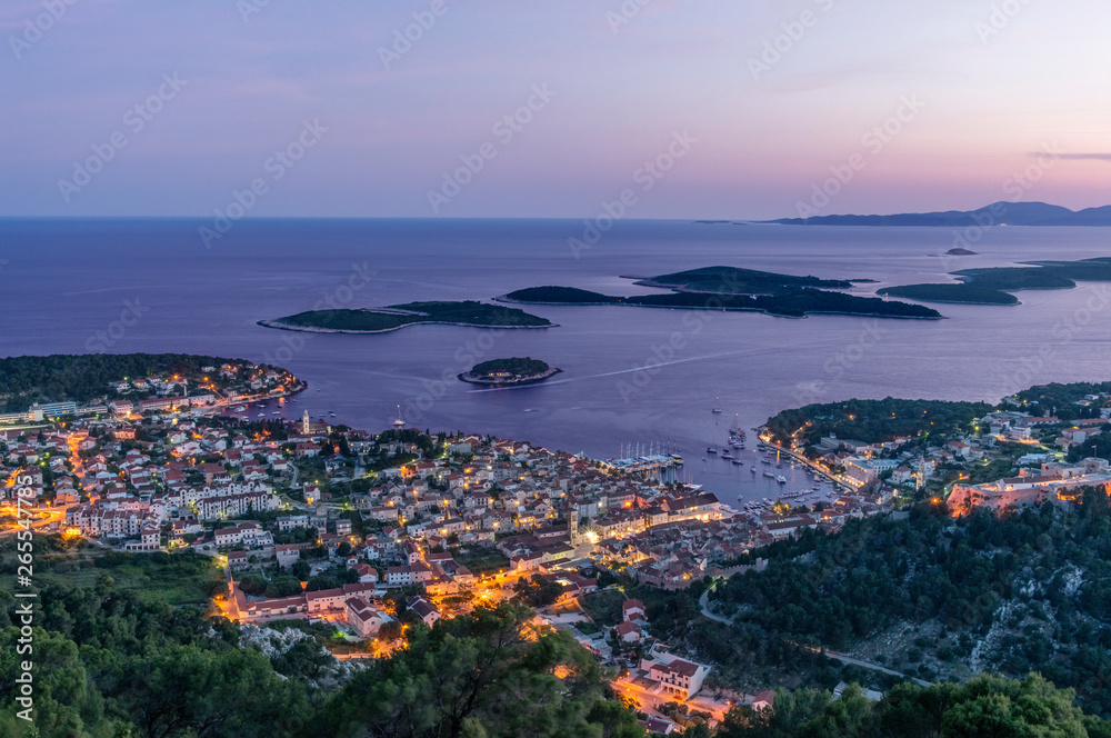 Aerial view of coastal town illuminated at night Aerial view of coastal town illuminated at night