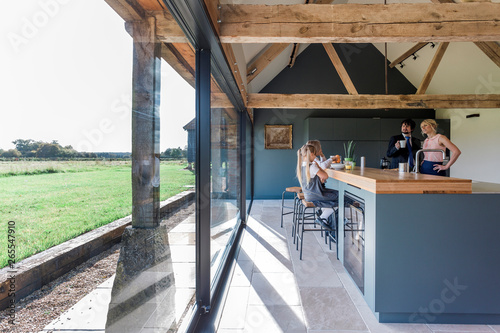 Caucasian family eating breakfast in kitchen