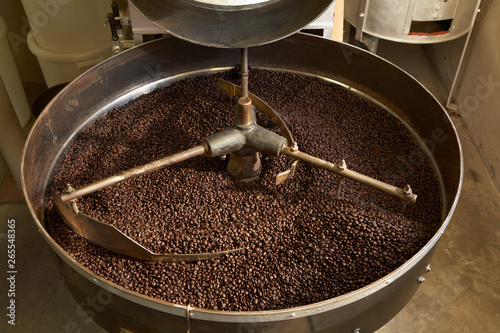 Coffee beans roasting in industrial kettle