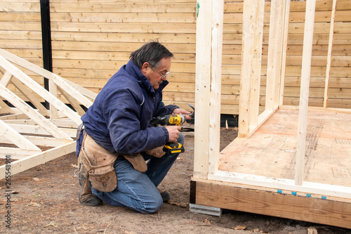 carpenter working on wood structure