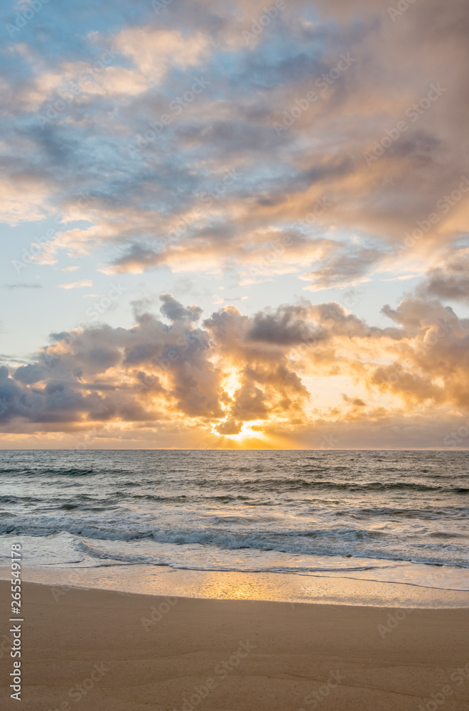 Sunrise over ocean on beach Sunrise over ocean on beach