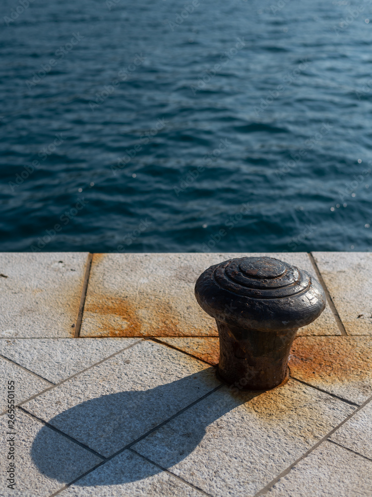 Rusty bollard in the harbour of Cres Rusty bollard in the harbour of Cres