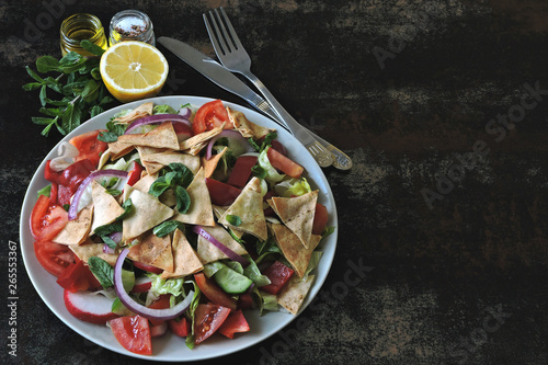 Healthy bright salad with pita bread and vegetables. Fattush Salad. Middle Eastern style.