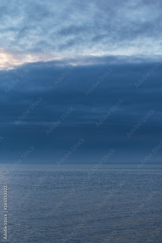 Dark and gloomy lake with clouds