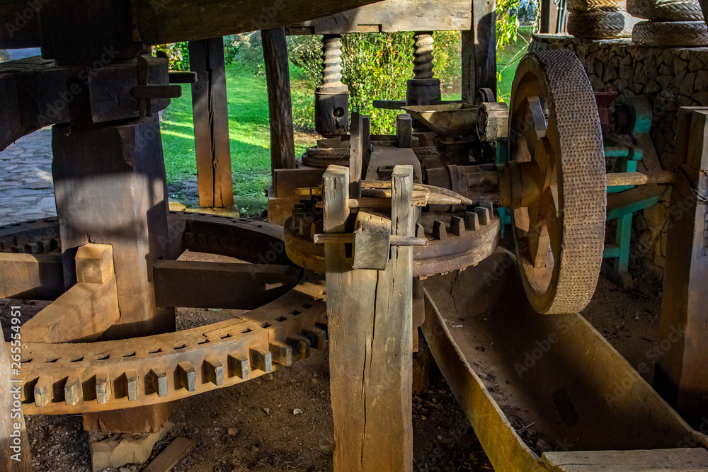 Interior of an old wooden mill. Large wooden gears. Interior of an old wooden mill. Large wooden gears.