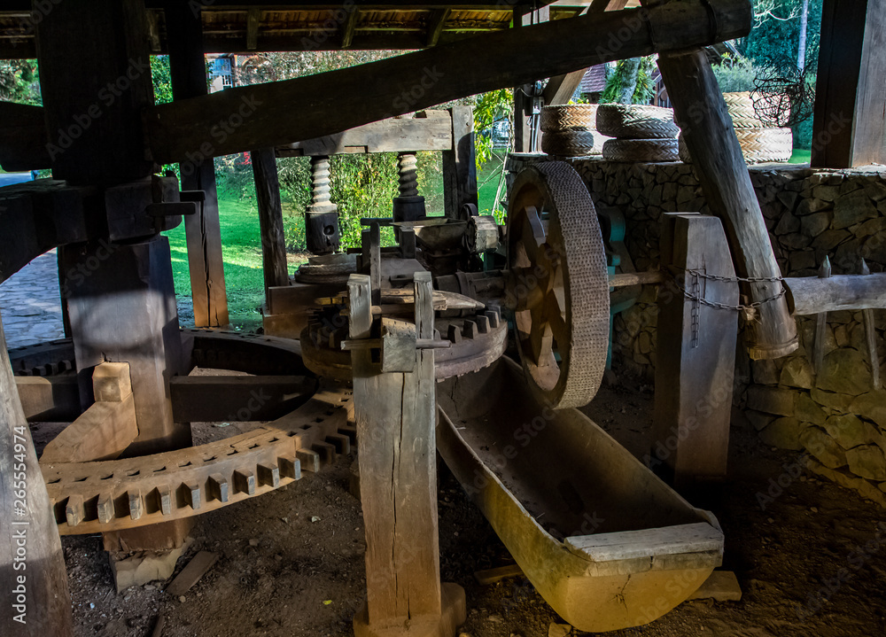 Interior of an old wooden mill. Large wooden gears. Interior of an old wooden mill. Large wooden gears.