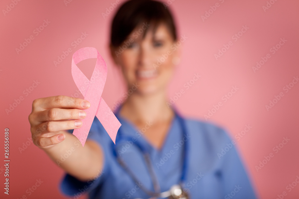 Happy Nurse Holding Breast Cancer Awareness Ribbon Happy Nurse Holding Breast Cancer Awareness Ribbon