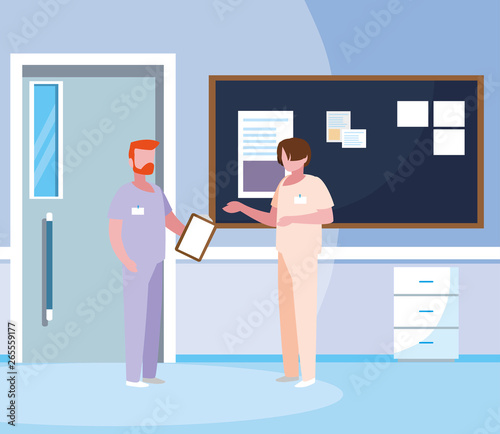 male medicine workers with uniforms in hospital corridor