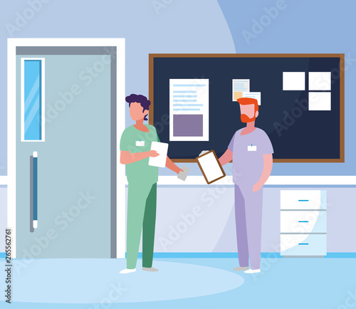 male medicine workers with uniforms in hospital corridor