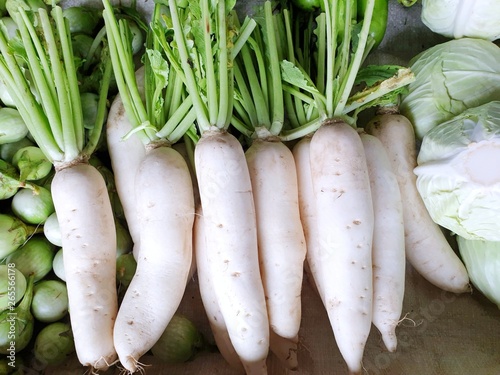Top view of fresh radishes as a background for sale in the market at Thailand, for cooking, healthy food concept