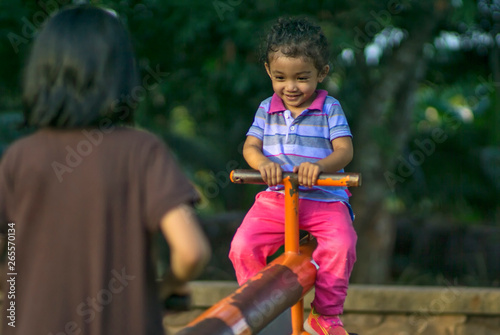 Cute little girl playing at the playground.