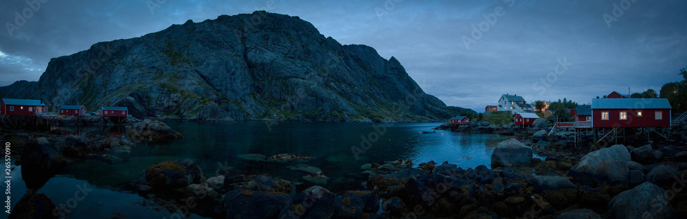 A panorama of a moody fishing village at dusk on Lofoton Island, above the arctic cirle in Norway