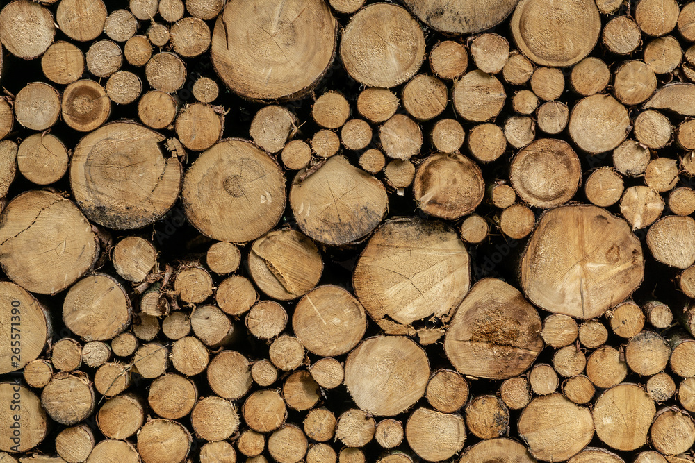 Stack of sawn logs. Natural wooden decor background. Stack of sawn logs. Natural wooden decor background.