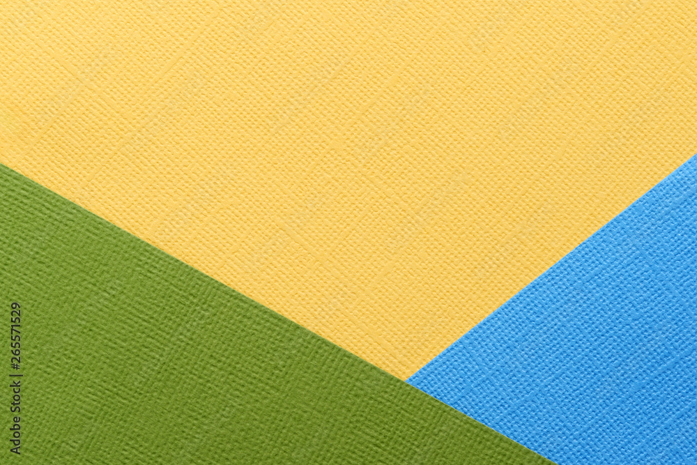 Fototapeta premium Blue, green, yellow abstract paper background. Paper texture close up