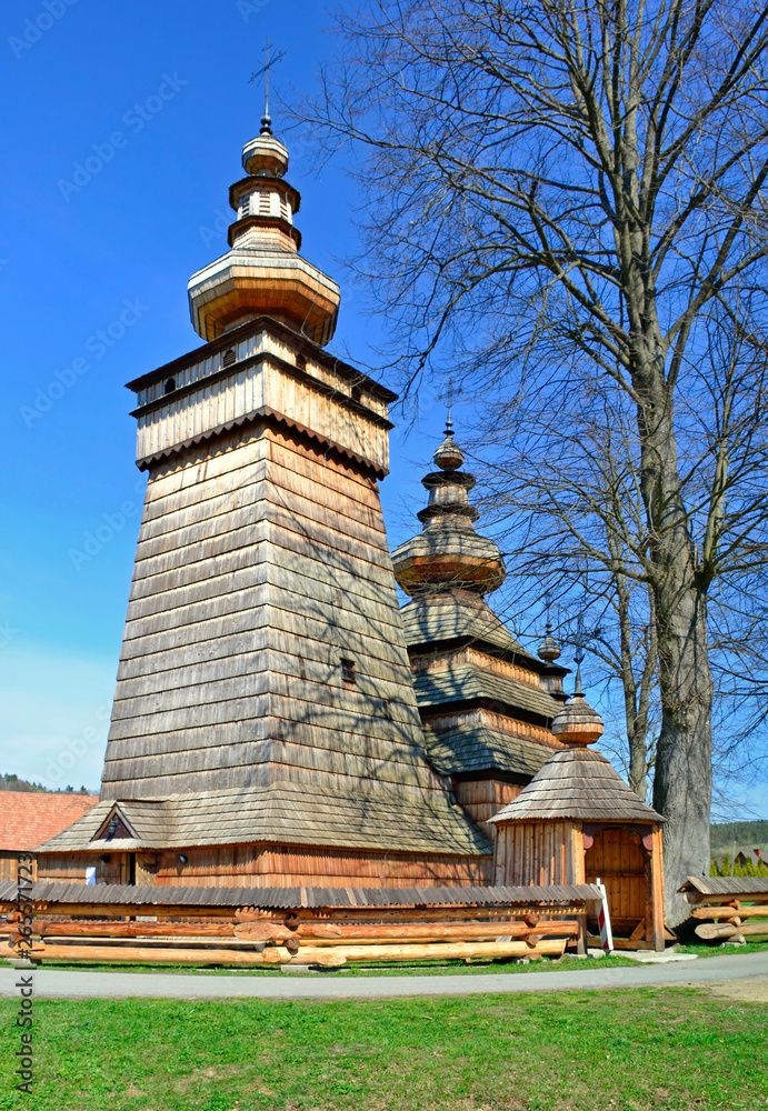 Beautiful ancient greek catholic wooden church in village of Kwiaton in spring, inscribed on the UNESCO World Heritage list, Low Beskids (Beskid Niski), Poland Beautiful ancient greek catholic wooden church in village of Kwiaton in spring, inscribed on the UNESCO World Heritage list, Low Beskids (Beskid Niski), Poland