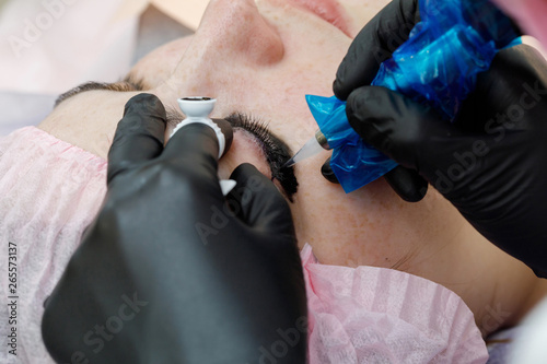 Permanent makup on face  woman having eyelid tattoo