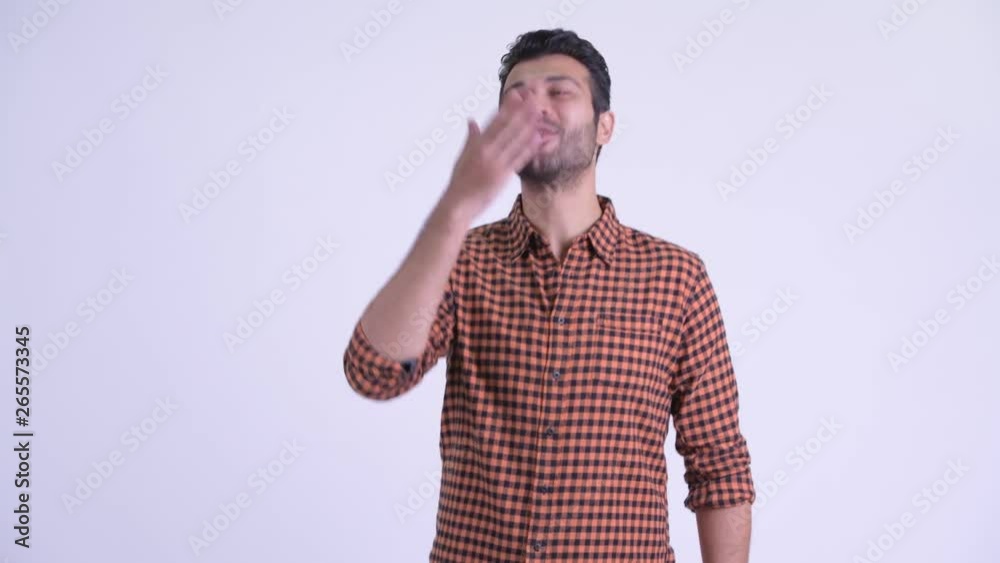 Happy bearded Persian hipster man blowing kiss Happy bearded Persian hipster man blowing kiss