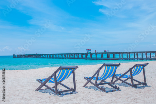 Beach chairs and bridges with sea and bright sky © apichon_tee