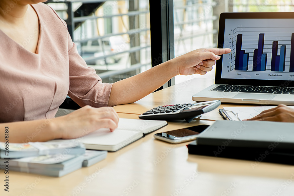 Business adviser analyzing financial figures denoting the progress Internal Revenue Service checking document. Audit concept Business adviser analyzing financial figures denoting the progress Internal Revenue Service checking document. Audit concept