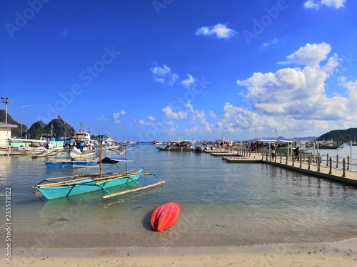 Typical Philippine habour in Puerto Princesa with boats for touristic trips waiting for their customers photo