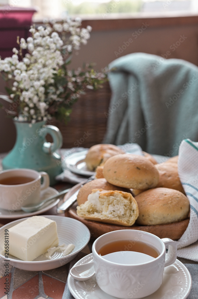 Homemade cakes with basil. A lot of small bread. Served Table meal for breakfast and tea. Lifestyle photo Homemade cakes with basil. A lot of small bread. Served Table meal for breakfast and tea. Lifestyle photo