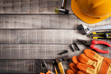 Labour Day,  Many handy tools on wooden background texture.