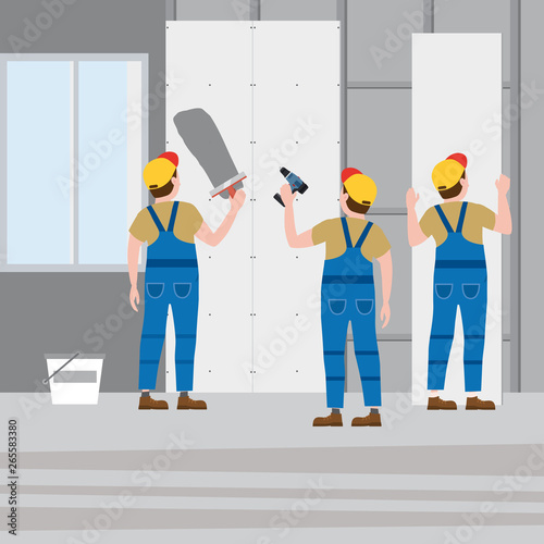 Workers put plaster, installing gypsum plasterboard panels in the interior