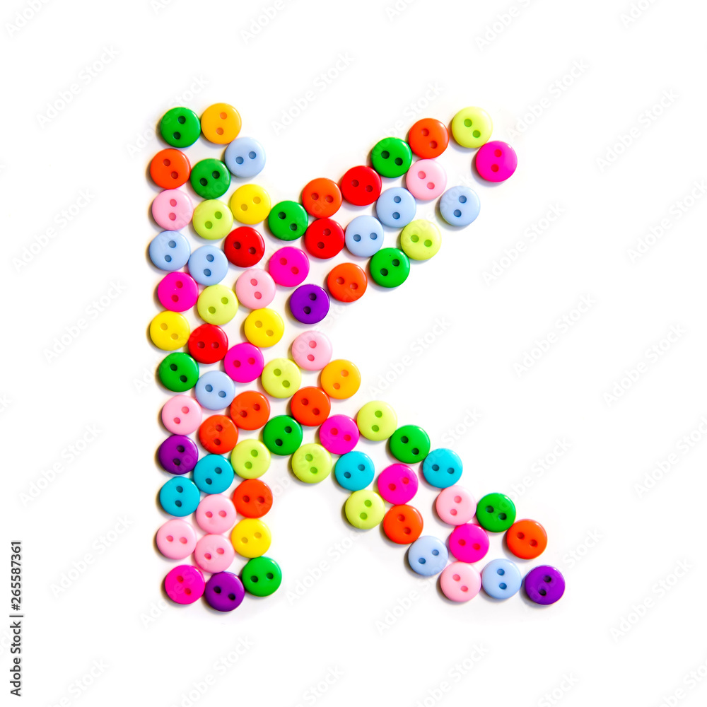 Letter K of the English alphabet made of multi-colored buttons