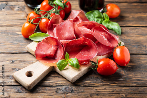 Italian antipasto with bresaola and red wine