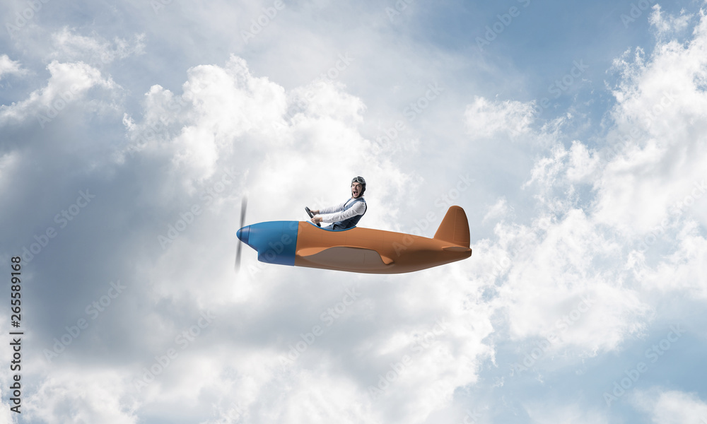 Man in aviator hat driving propeller plane Man in aviator hat driving propeller plane