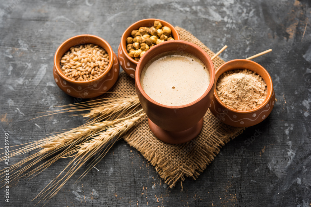 Sattu sharbat is a cooling sweet drink made in summer with roasted black chickpea flour, barley, suger, salt & water. served in a glass. selective focus Sattu sharbat is a cooling sweet drink made in summer with roasted black chickpea flour, barley, suger, salt & water. served in a glass. selective focus
