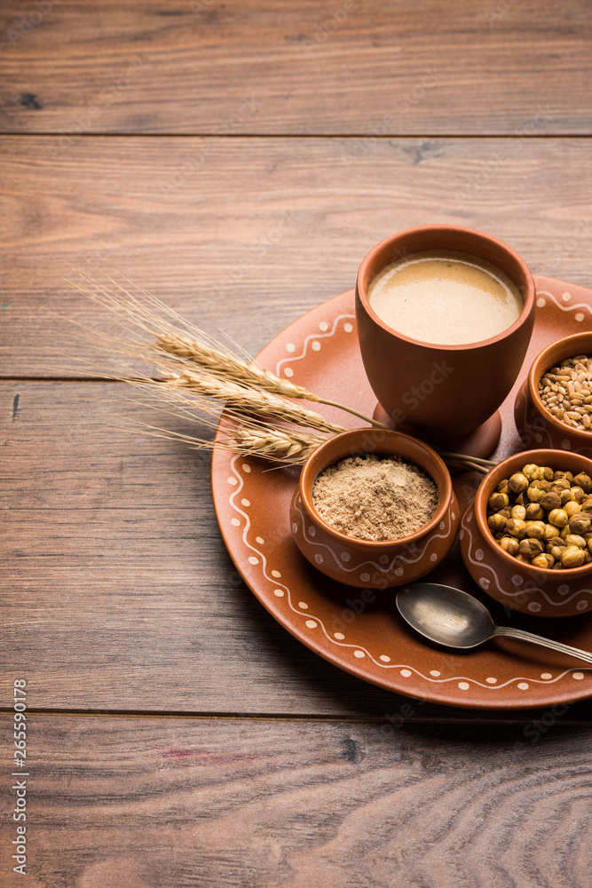 Sattu sharbat is a cooling sweet drink made in summer with roasted black chickpea flour, barley, suger, salt & water. served in a glass. selective focus Sattu sharbat is a cooling sweet drink made in summer with roasted black chickpea flour, barley, suger, salt & water. served in a glass. selective focus