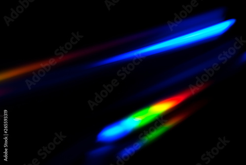 Abstract colorful spectrum in darkness. Colorful rays of light. photo