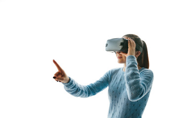 The woman with glasses of virtual reality on a white background. Future technology concept. Modern imaging technology.