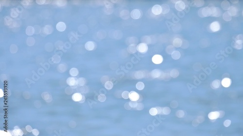  Blurred water surface with bokeh light and blue color for background texture 