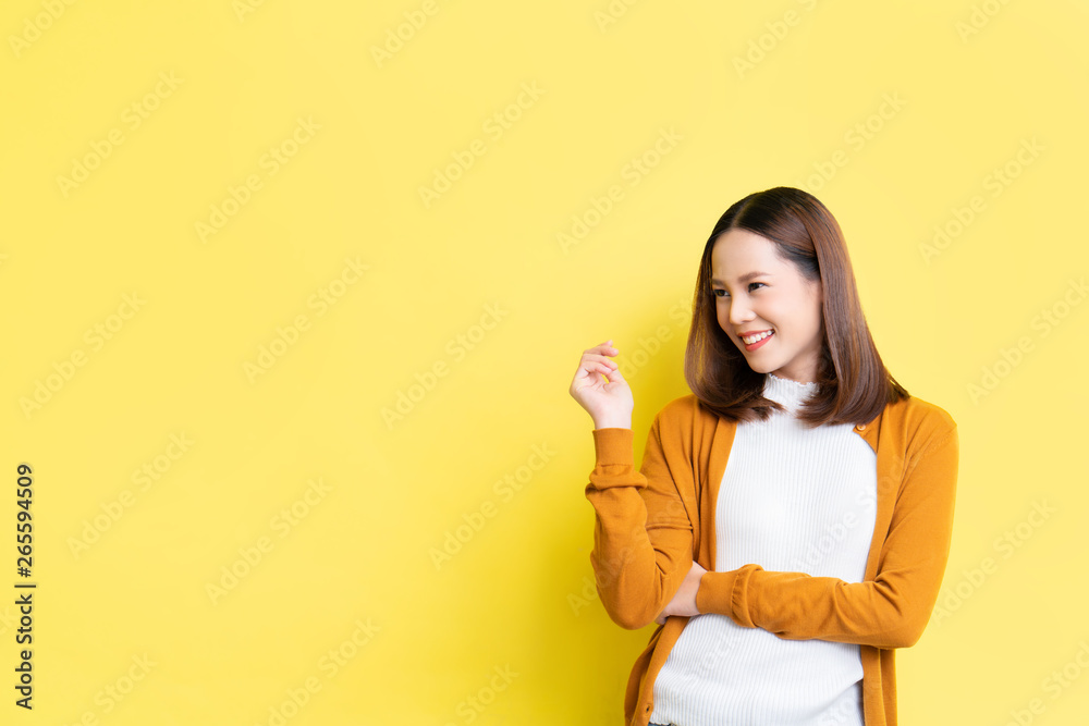 Asian women she is refreshing in yellow background.