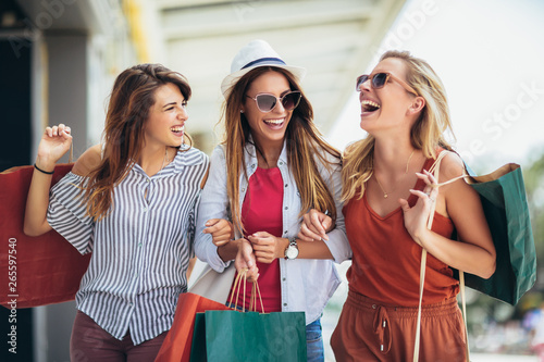 Beautiful woman with shopping bags in the city-sale, shopping, tourism and happy people concept photo