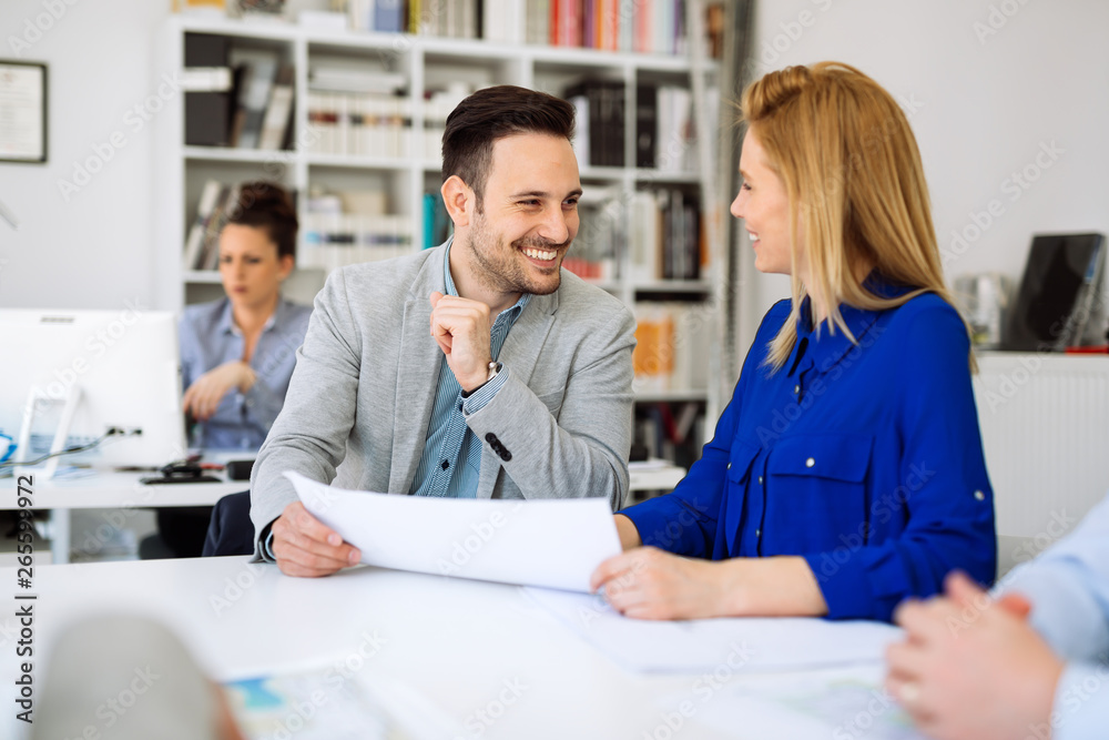 Group of business people working as team in office Group of business people working as team in office