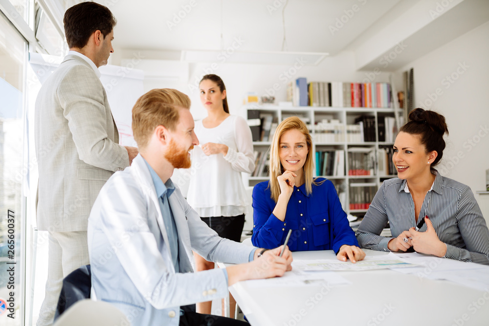 Group of business people working as team in office Group of business people working as team in office