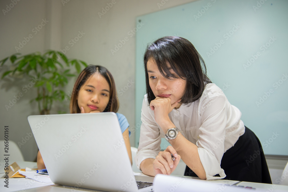 Young Asian employee work in the office Young Asian employee work in the office