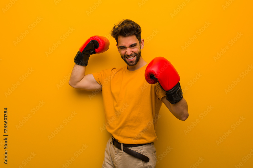 Young man wearing boxing gloves Young man wearing boxing gloves