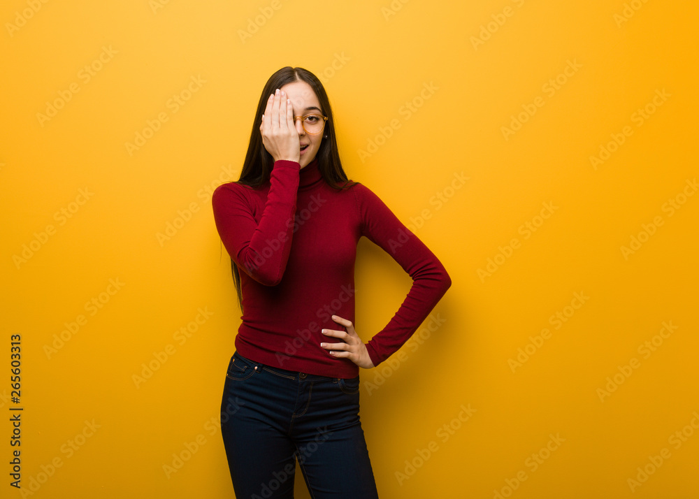 Intellectual young girl shouting happy and covering face with hand Intellectual young girl shouting happy and covering face with hand