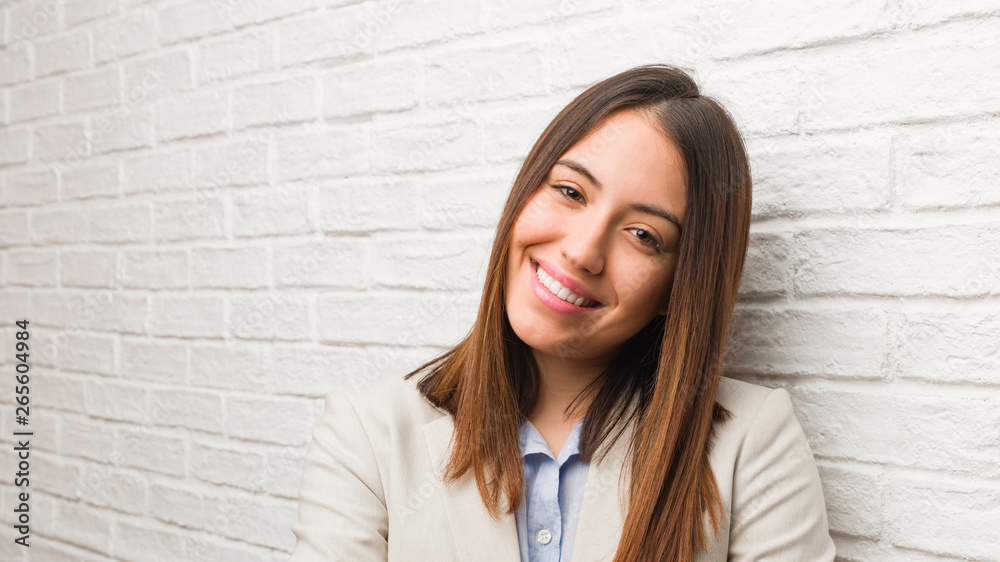 Young business woman crossing arms, smiling and relaxed Young business woman crossing arms, smiling and relaxed