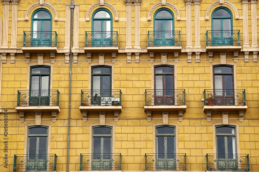 window on the yellow building facade in Bilbao city in Spain.