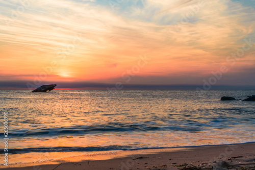 Sunset Beach and the sunken SS Atlantic at sunset in early spring with warm vivid light - Cape May Point NJ