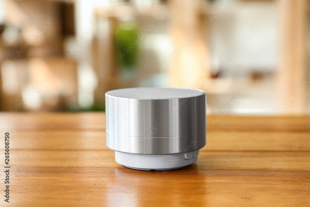 Smart home assistant device on table in room Smart home assistant device on table in room