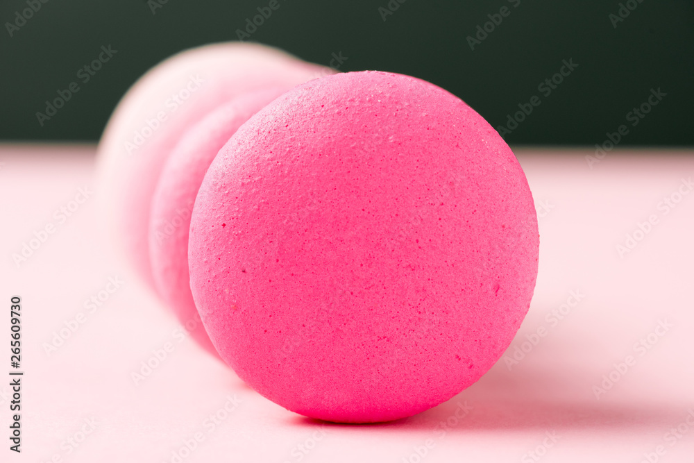 selective focus of sweet colorful macarons on pink surface selective focus of sweet colorful macarons on pink surface